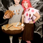 Couple in Halloween Costume in front of a photobooth