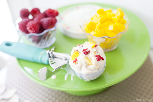 mango ice cream with raspberries