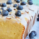A perfectly moist and lemony Gluten Free Lemon Pound Cake with Vanilla Glaze topped with almonds and fresh blueberries. Does life get much sweeter???