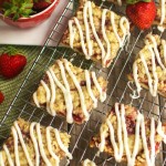 Strawberry Crumb Bars - Crispy cookie crust with a sweet strawberry layer, buttery crumble, and white chocolate glaze. A perfect treat for summer!