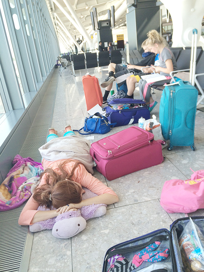 Laying on the airport floor taking a rest