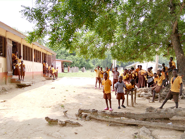 waving goodbye to Ghana school children