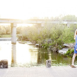 senior pictures walking on bridge