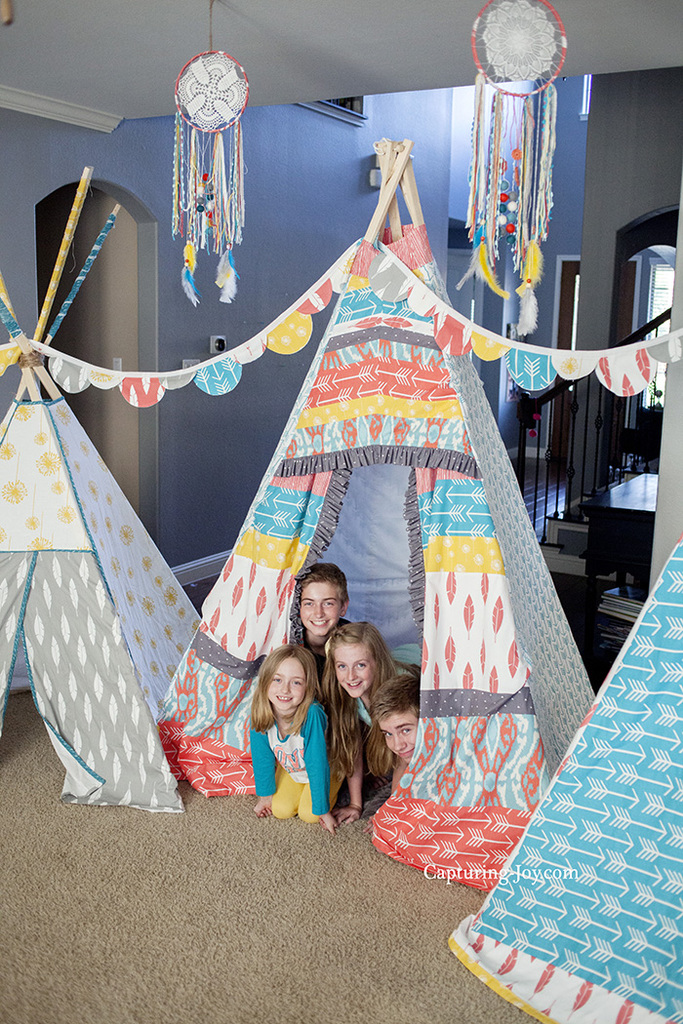 Kids camping out in fabric teepees