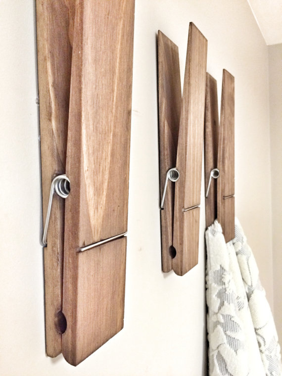 These large clothes pins are cute as laundry room decoration but can double as a place to hang your towels to make sure they are completely dry.