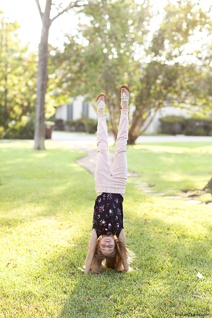 handstand in pink jeans