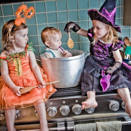 Three kids making witch's brew